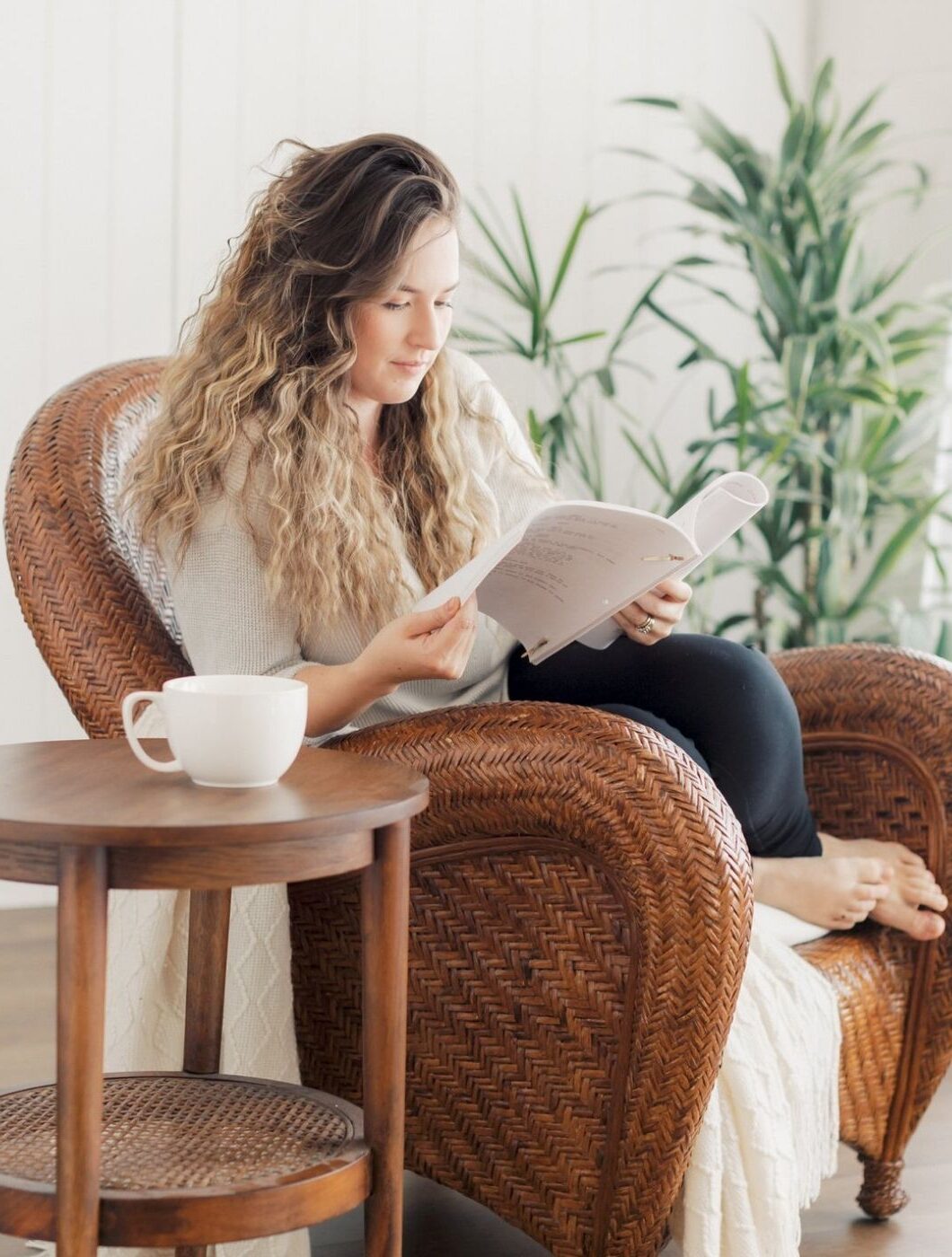 Homeschool mom reading Homeschool mom reading in a wicker chair